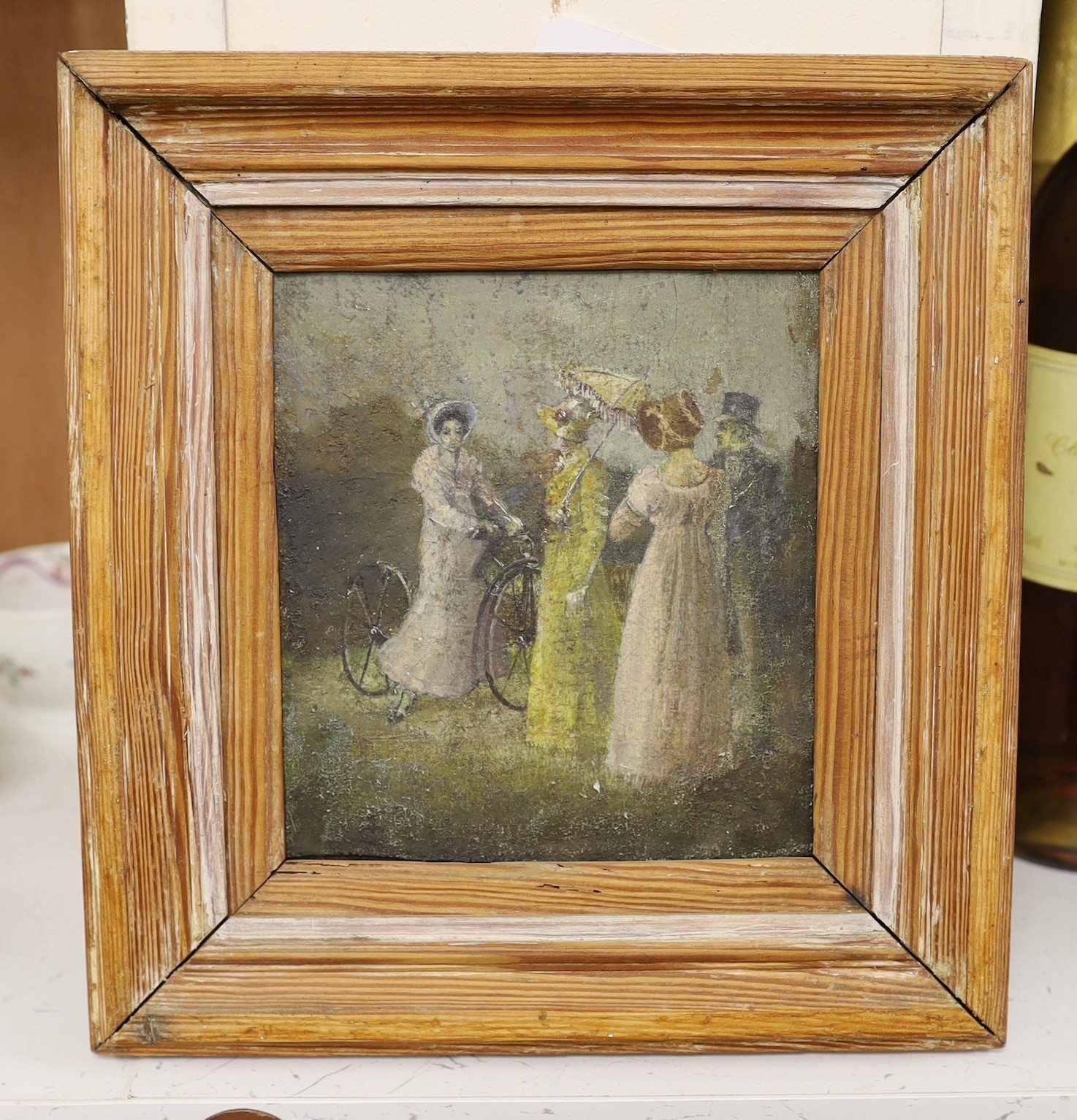 Cycling interest. An early Victorian oil on panel with figures admiring a woman riding an early bicycle, 15 x 13.5 cm